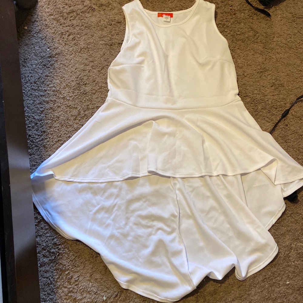 Short sleeve blouse, long in the back , short in the front. Size 1X from rainbow